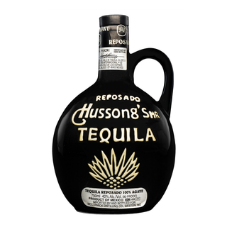 Hussong's Tequila Reposado 700ml comes in a round black bottle with bold white and gold text, a right-side handle, silver agave illustration, black cap and label. Enjoy its smooth flavor with notes of toasted oak.