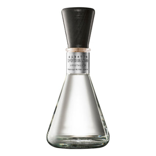 A clear, conical glass bottle of Maestro Dobel 50 Cristalino Extra Anejo Tequila 750ml features a wide base, silver label, and black wooden cap—crafted to highlight notes of toasted oak and sweet agave.