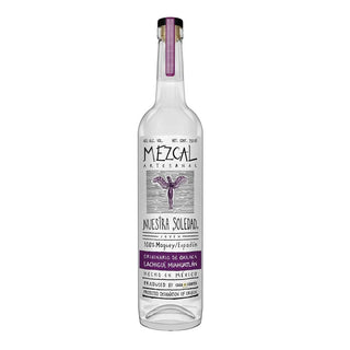A clear bottle of Nuestra Soledad Lachigui Mezcal 750ml with a purple label, black text, and a purple ribbon on the cap. The label notes 100% Maguey Espadín, crafted in Oaxaca, Mexico, with light smoke and sweet agave flavors.
