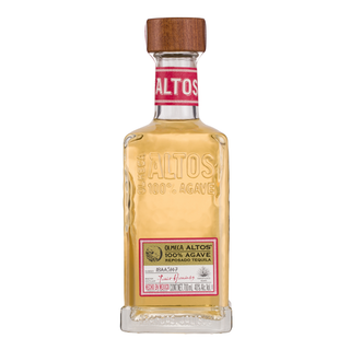 Olmeca Altos Reposado Tequila 700mL comes in a clear glass bottle with a wooden cap, red and white label, and embossed “ALTOS 100% AGAVE.” The light golden tequila features notes of cooked agave and toasted oak.