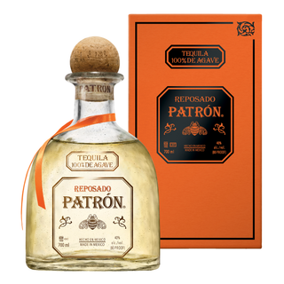 Patrón Reposado tequila bottle with orange ribbon and box on a white background