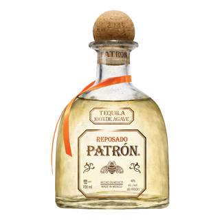 Patrón Reposado tequila bottle with cork on a white background