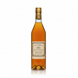 Bottle of Cognac with vineyard in the background