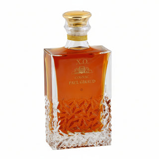 Cognac bottle with gold cap on a white background