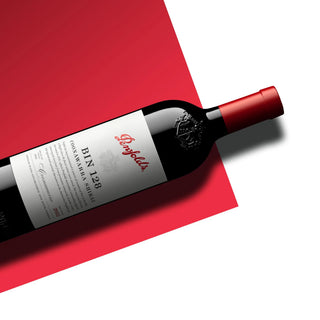 Penfolds Bin 128 wine bottle on a red and white background
