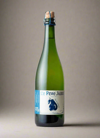 Green bottle with cork and 'Le Pere Jules' label on a gray background