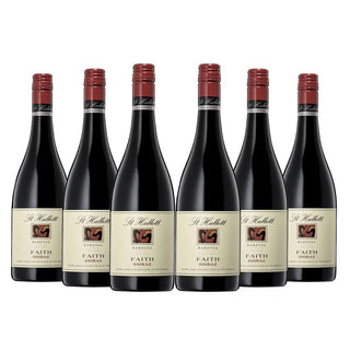 Six bottles of St Hallett Faith Shiraz wine on a white background