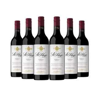 Six bottles of St Hugues Merlot wine on a white background