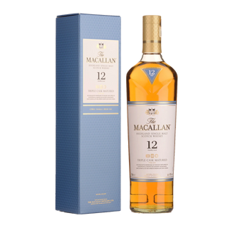A bottle of The Macallan Triple Cask 12 Year Old Single Malt Scotch Whisky stands beside its elegant blue and gold box, celebrated for its smooth vanilla notes and subtle hints of citrus.