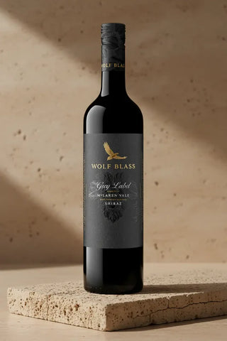 Wolf Blass wine bottle on a textured surface with a neutral background